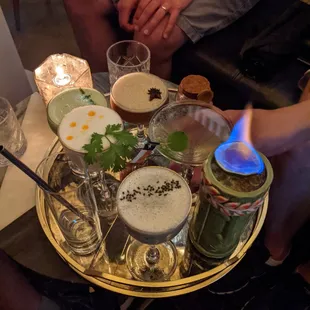 Clockwise starting with the flaming one: Éscorpion, Concrete Jungle, Tom Kha Gai Guys, Matcha Mucho, One of These Nights, and The Mo Mo.