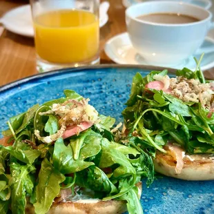 Smoked salmon, bagel, and cream cheese with arugula