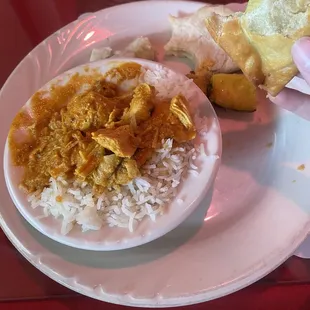 Curry in a bowl and other food from buffet