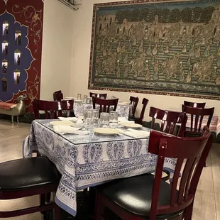 a dining room with a table and chairs