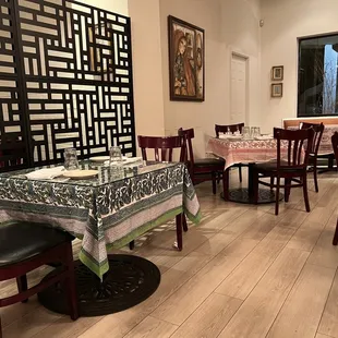 a dining room with tables and chairs