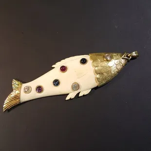 Custom Father's Day Pendant in 14k and fossil ivory, with the birthstones set in order on the body.