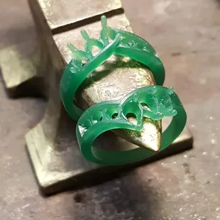 Designed with our customer to use her old diamonds, we hand carved her anniversary bands in wax.