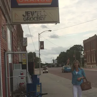 a woman standing in front of a store