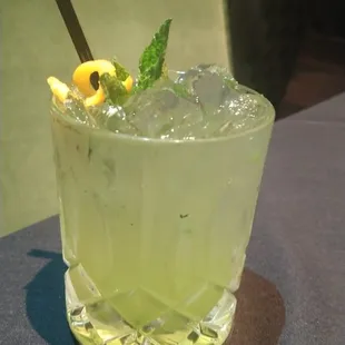 a glass of lemonade on a table