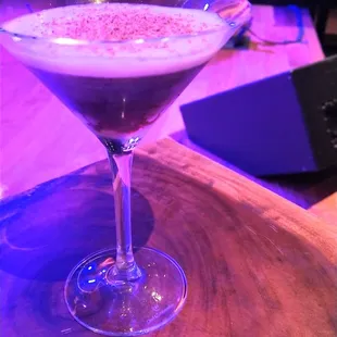 a cocktail in a glass on a table