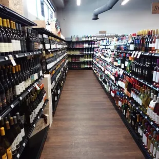 rows of bottles of wine in a store