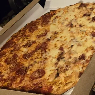 Half pepperoni half chicken bacon Alfredo