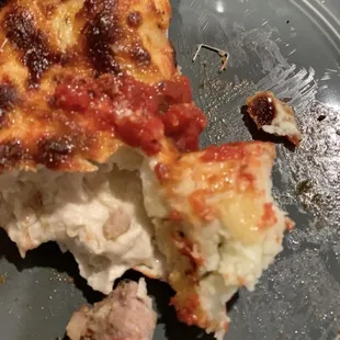 Detroit pizza w/ undercooked dough and staple