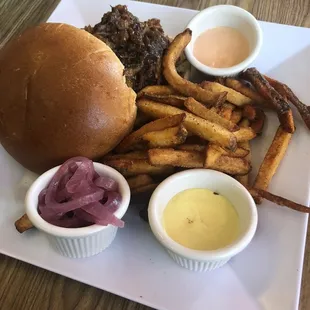 bbq pulled pork sandwich. came with pickles onions and i also asked for pickles to put on it. so delicious!