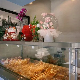 a variety of pastries in a display case