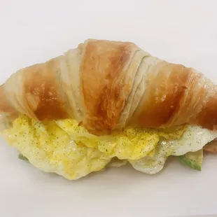 a croissant sandwich on a plate