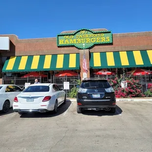 two cars parked in front of the restaurant