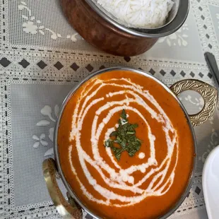 a bowl of soup and a bowl of rice