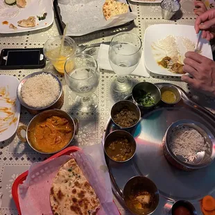 Jhapali Chicken Thali Chicken Makhanu (Butter chicken) Garlic Naan Tandoori Paratha Mango Lassi