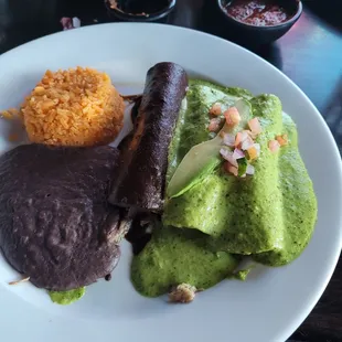 Two avocado (with chicken) and one Brisket mole enchilada