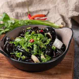 a bowl of black beans and cilantro