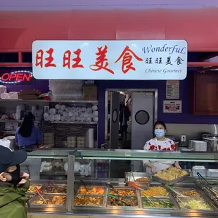 a woman standing in front of the counter