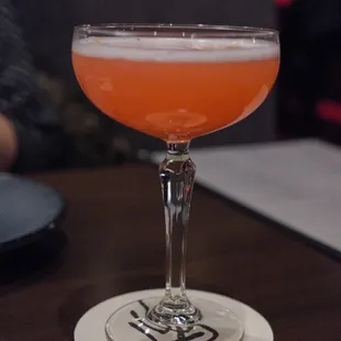 a cocktail in a coupe glass
