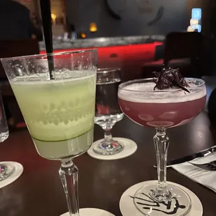 three cocktails on a table