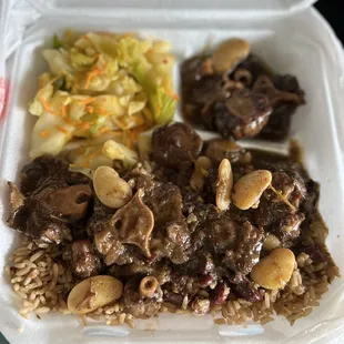 Oxtail with rice and beans and cabbage