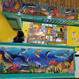 a woman standing at the counter