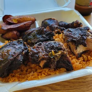 Jerk chicken, jollof rice, and fried plantains