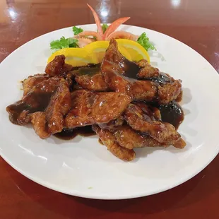 a plate of chicken and vegetables