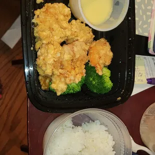 a meal of rice, broccoli, and chicken