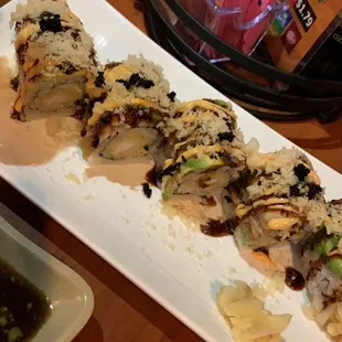 a plate of sushi and a bowl of soup