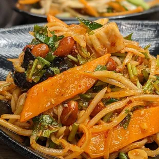 a plate of stir fried noodles