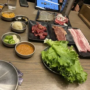 a table of food and a laptop