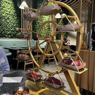 a ferris wheel with a variety of pastries on it