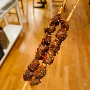 a skewer of meat on a stick