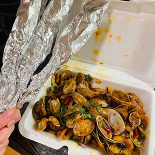 a container of clams on a table