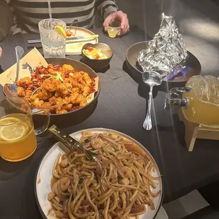 Udon noodles, fried chicken, ginger and cheese curds, and sizzling beef