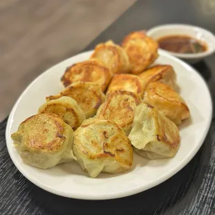 Pan Fried Dumplings- 6 Pork &amp; Napa/6 Shrimp, Chicken, Carrots.  Perfectly cooked, great ratio, but a bit bland.