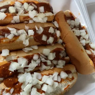 Chili, cheese and onion hotdogs