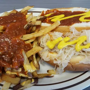 1 dog w chili, cheese, mustard. 1 w chili, cheese, mustard, and kraut. Fries w chili and cheese.