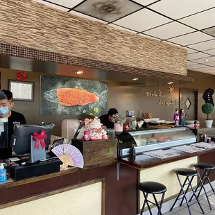 a man and woman behind the counter