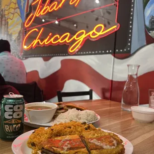 a plate of food and a can of beer