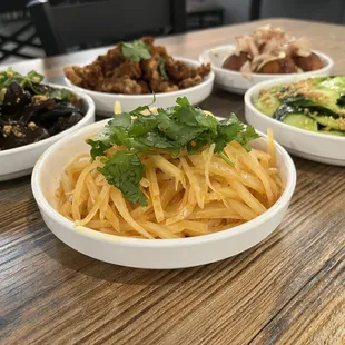 four bowls of food on a table