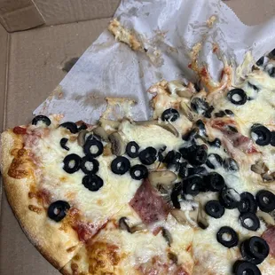 Notice the cheese-pull on the paper.. That is the sign of a good pizza.