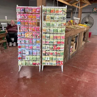 a woman sitting at a fruit stand