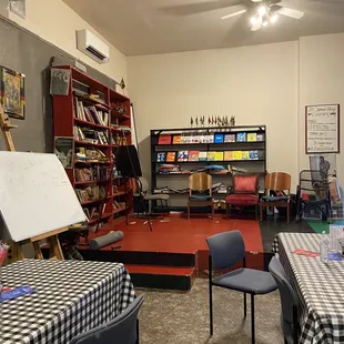 a dining area with tables and chairs