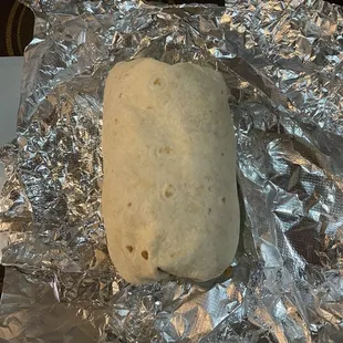 a burrito wrapped in tin foil