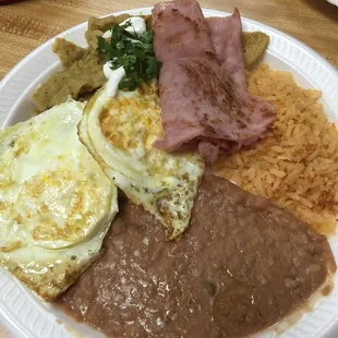 Chilaquiles with a side of ham.