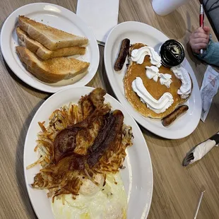 Over medium eggs with well done hashbrowns and bacon, dry rye toast, and the kids chocolate chip pancake with sausage