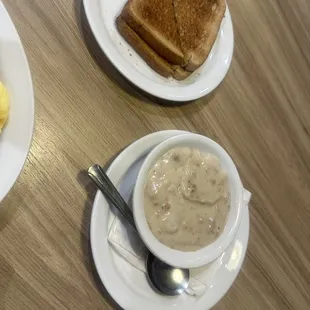Side of sausage, gravy, and wheat toast