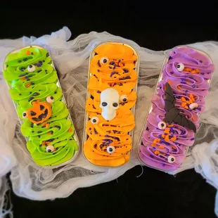 three decorated skateboards